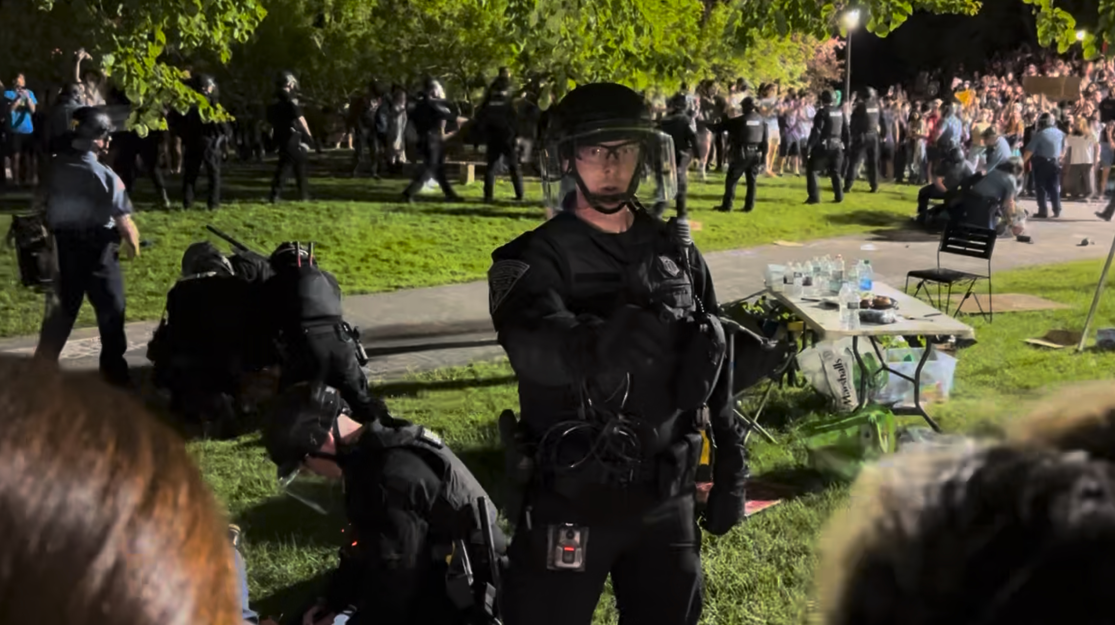 A state police officer points pepper spray at pro-Palestine demonstrators during the university's crackdown on a protest encampment on May 7, 2024.